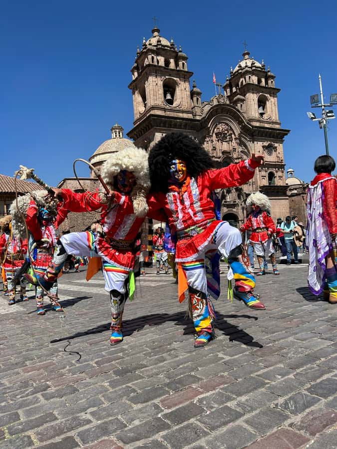 Cusco's historical tour and San Pedro Market bites - Starting in Plaza de Armas with two Cuscos in view