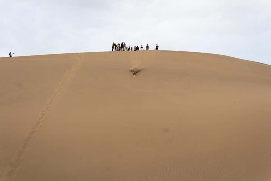 Huacachina: Sandboarding and 4x4 Desert Adventure - Sliding down different dunes