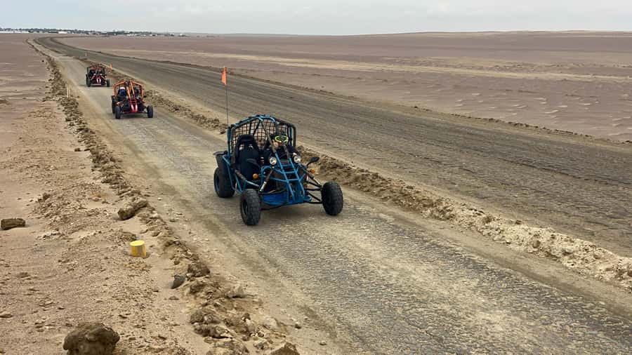 Mini Buggy GO KART in Paracas National Reserve - Yumaque Beach, calm water beneath the desert