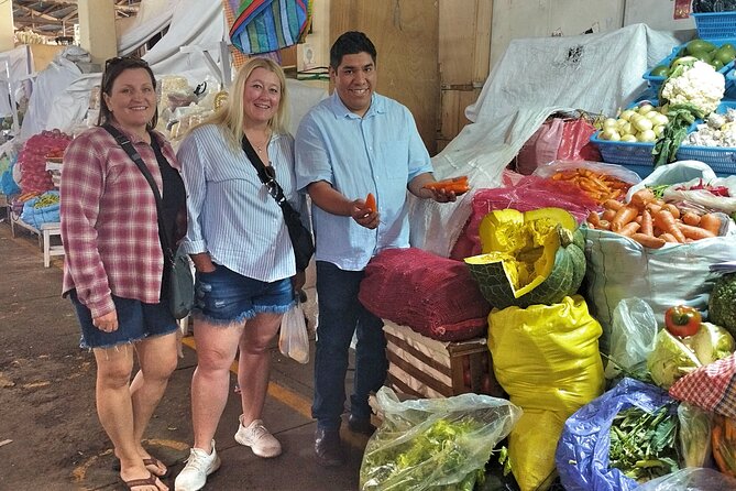 Peruvian Cooking Class Cocktails and Market Tour in Cusco - Mixing two cocktails with pisco and local fruit